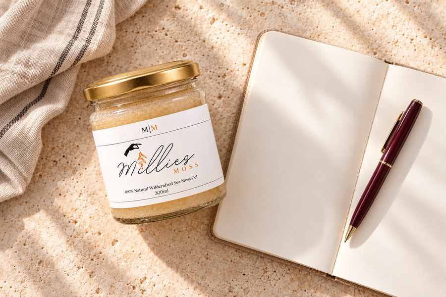 A Millie’s Moss Golden Gel jar beside an open notebook and burgundy pen.