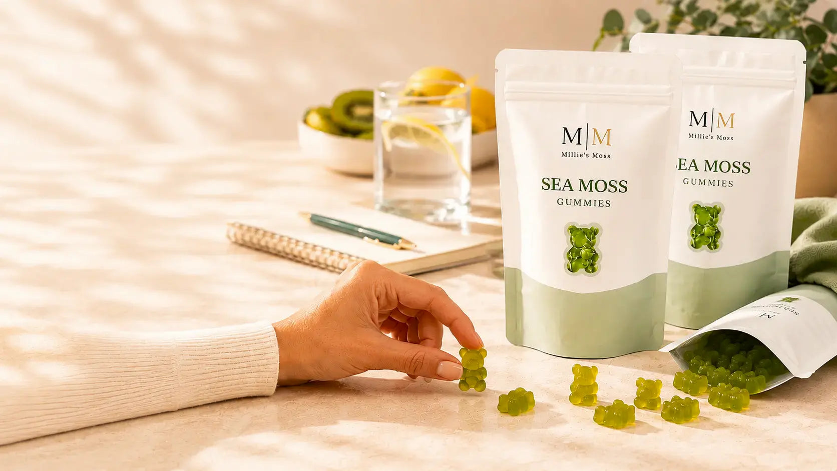 Apple flavour sea moss gummies pouches with green gummy bears on a bright kitchen counter.