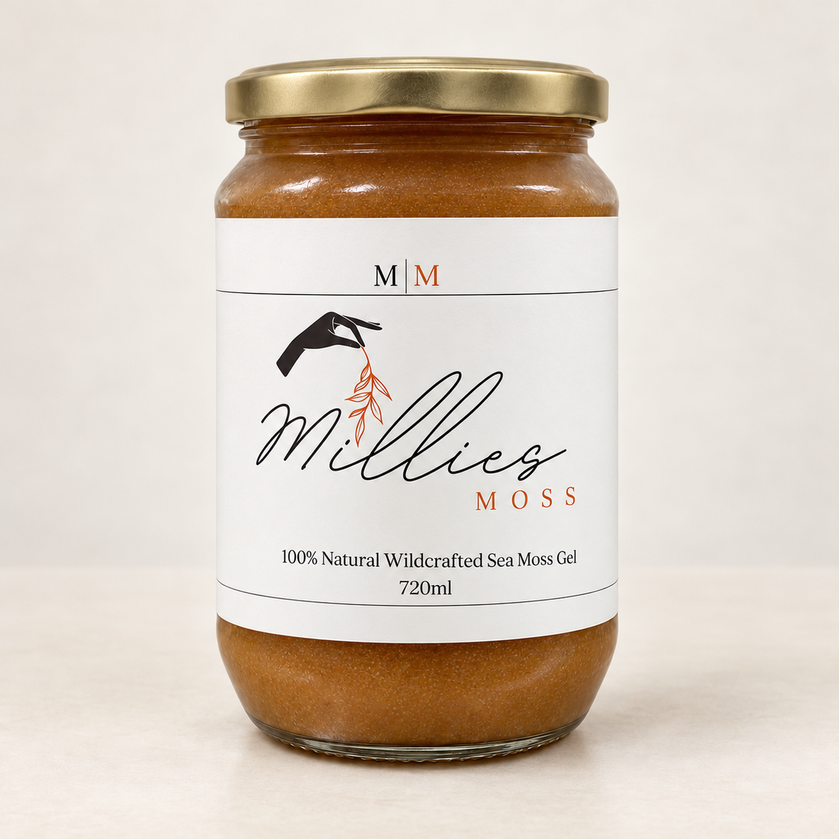 Millie’s Moss Medjool Dates Infused Sea Moss Gel 720ml glass jar with a gold lid on a warm off-white background.