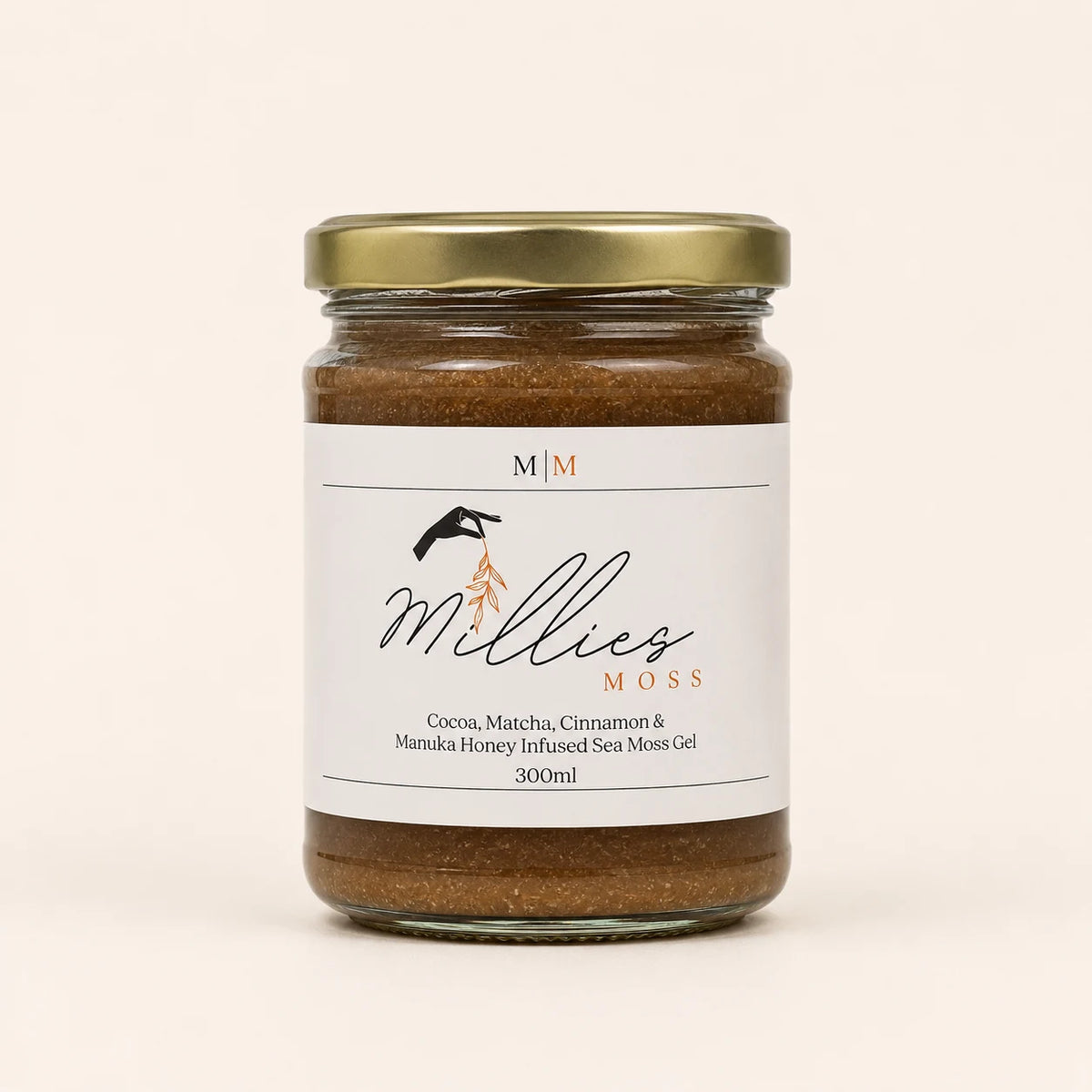 Millie’s Moss Cocoa, Matcha, Cinnamon & Manuka Honey Infused Sea Moss Gel 300ml jar on a warm off-white background.