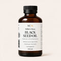 Front view of Millie's Moss High Strength Black Seed Oil 100ml bottle on an off-white background.