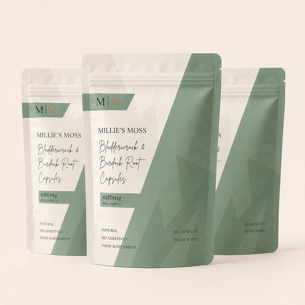 Three-pack bundle image of Millie’s Moss Bladderwrack & Burdock Root Capsules on a soft off-white background.