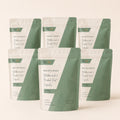 Six-pack bundle image of Millie’s Moss Bladderwrack & Burdock Root Capsules on a soft off-white background.