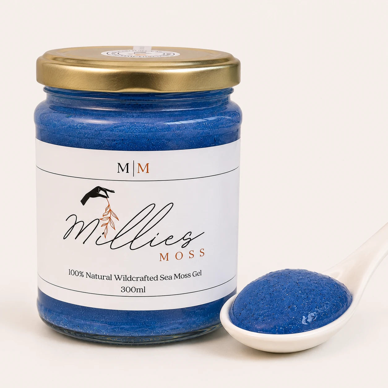 Close-up of Millie's Moss Blue Spirulina Infused Sea Moss Gel showing its naturally blended texture beside the jar