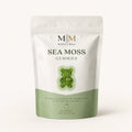 Millie’s Moss Apple Sea Moss Gummies pouch on a soft cream background.
