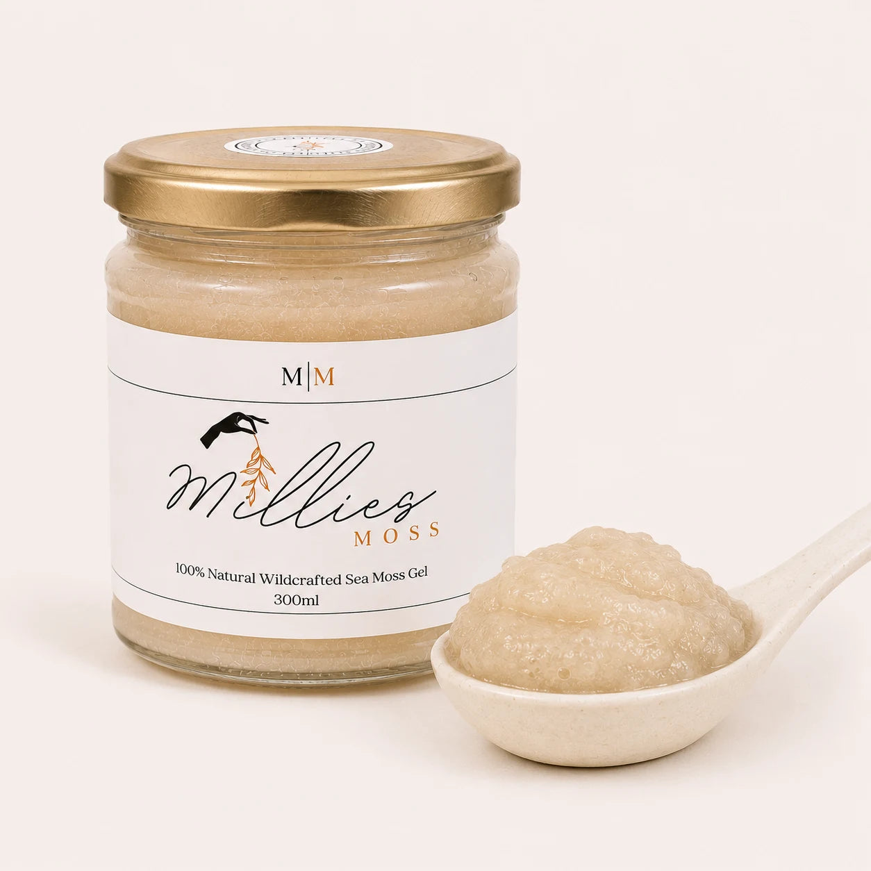 Close-up of Millie's Moss Premium Golden Sea Moss Gel showing its naturally blended texture beside the jar