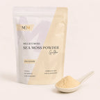 Close-up of Millie's Moss Premium Sea Moss Powder showing its finely milled natural texture beside the pouch