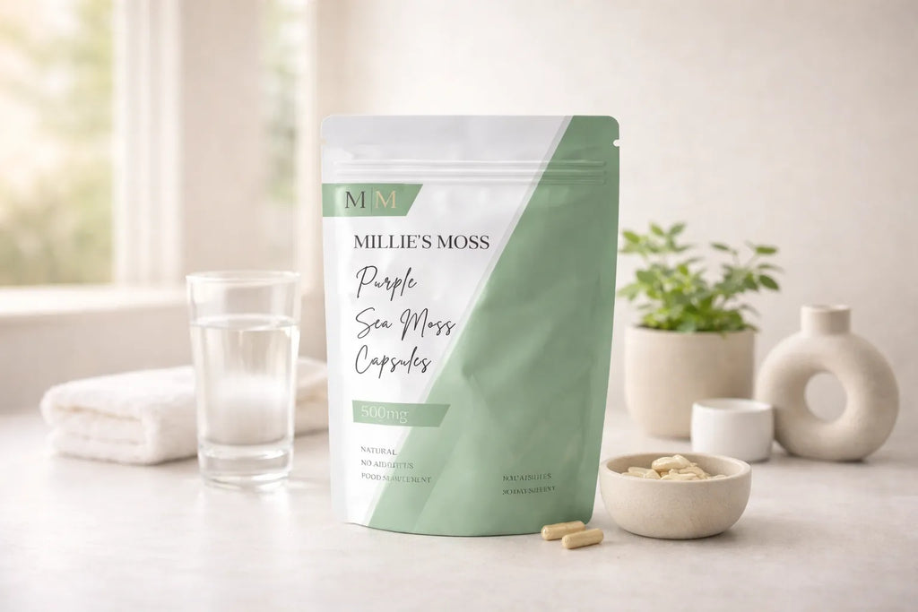 Millie’s Moss purple sea moss capsules displayed with a glass of water in a clean wellness setting.