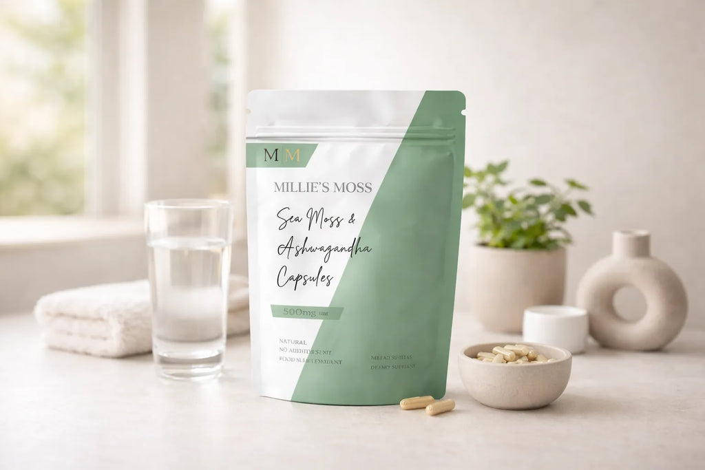 Millie’s Moss sea moss and ashwagandha capsules displayed with a glass of water in a clean wellness setting.