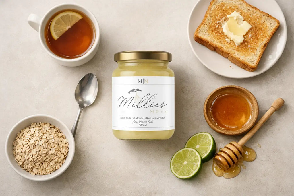 Jar of sea moss gel with Manuka honey on a kitchen counter beside a glass of water and mug