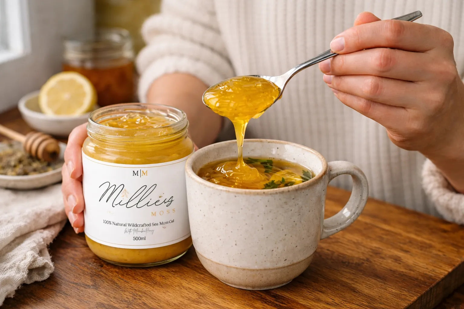 Spoonful of sea moss gel with Manuka honey being added to a warm herbal tea