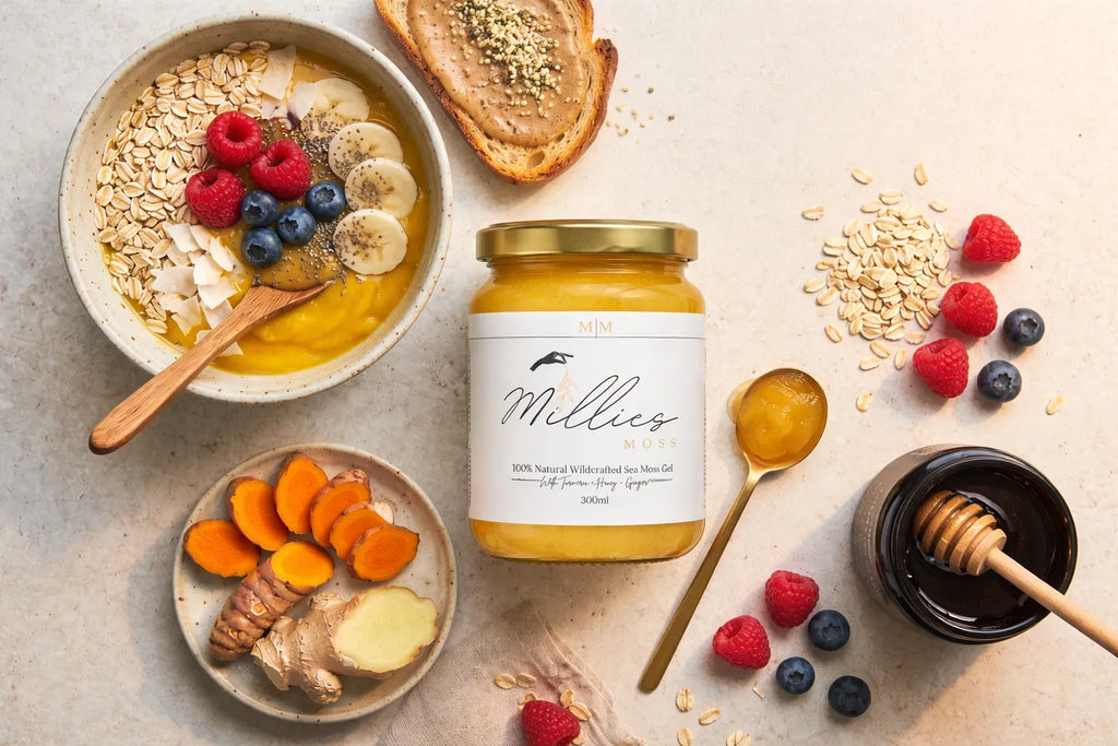 Sea moss gel with turmeric, honey and ginger surrounded by oats, berries and smoothie bowl ingredients