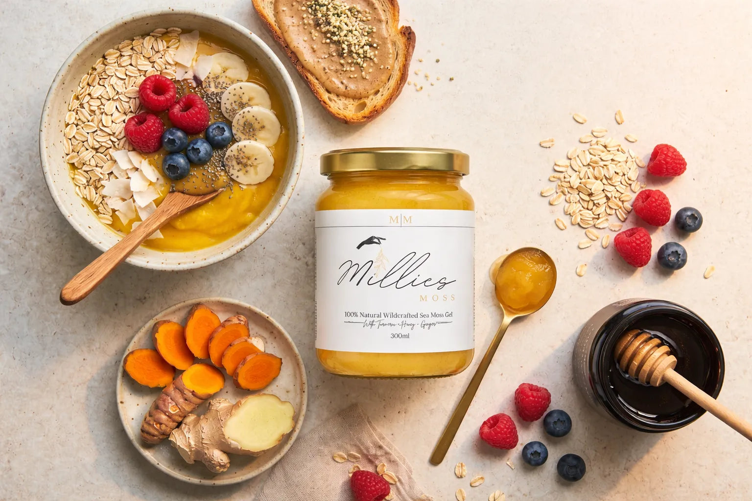 Sea moss gel with turmeric, honey and ginger surrounded by oats, berries and smoothie bowl ingredients