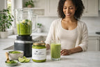 Woman preparing green matcha sea moss smoothie with blender and Millies sea moss gel in bright kitchen